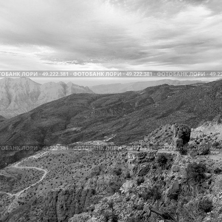 gorge and canyon the deep cloudy sky   in oman the old  mountain . Стоковое фото, агентство Ingram Publishing / Фотобанк Лори