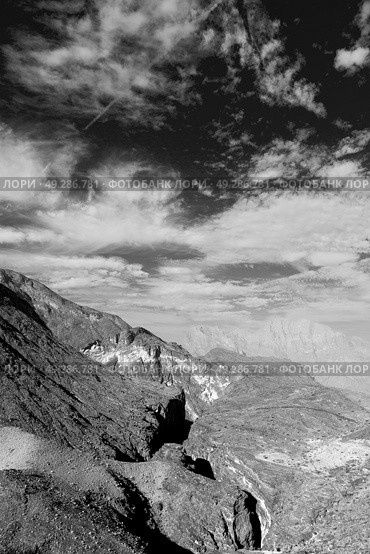  gorge and canyon the deep cloudy sky   in oman the old  mountain . Стоковое фото, агентство Ingram Publishing / Фотобанк Лори