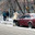 Девушка очищает обледеневший "Mitsubishi Lancer EVOLUTION X". Снег с дождем (2010 год). Редакционное фото, фотограф Сергей Лешков / Фотобанк Лори