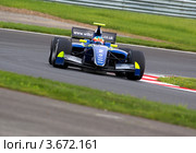 Болиды Формулы 3.5 участвуют в гонках на чемпионате "Мировая серия Renault" на треке "Moscow Raceway" в Подмосковье (2012 год). Редакционное фото, фотограф Николай Винокуров / Фотобанк Лори