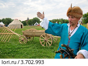 Историческая реконструкция казачьего стана на фестивале "Времена и эпохи" в Коломенском, Москва, Россия (2012 год). Редакционное фото, фотограф Николай Винокуров / Фотобанк Лори
