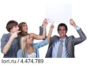 Студенты и преподаватель с баннером. Стоковое фото, фотограф Phovoir Images / Фотобанк Лори