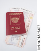 Паспорт с вложенными в него железнодорожными билетами (2013 год). Редакционное фото, фотограф Литвяк Игорь / Фотобанк Лори