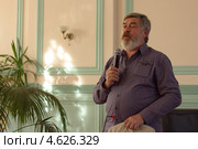 Российский писатель  Сергей Трофимович Алексеев, автор бестселлеров «Слово», «Сокровища Валькирии» на встрече с читателями (2013 год). Редакционное фото, фотограф Копосова Татьяна Геннадьевна / Фотобанк Лори