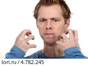 Злой молодой человек. Стоковое фото, фотограф Phovoir Images / Фотобанк Лори