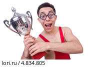 Карикатурная фигура астеничного мужчины в борцовской форме с кубком. Стоковое фото, фотограф Elnur / Фотобанк Лори