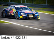 Автомобиль Audi RS 5 DTM команды Audi Sport Team Abt Sportsline участвует в гоночной серии кузовных автомобилей Deutsche Tourenwagen Masters на трассе Moscow Raceway в Подмосковье 3 августа 2013. Редакционное фото, фотограф Николай Винокуров / Фотобанк Лори