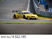 Автомобиль BMW M3 DTM участвует в гоночной серии кузовных автомобилей Deutsche Tourenwagen Masters на трассе Moscow Raceway в Подмосковье 3 августа 2013. Редакционное фото, фотограф Николай Винокуров / Фотобанк Лори