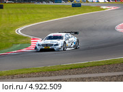 Автомобиль DTM Mercedes AMG C-Coupe команды Mercedes AMG участвует в гоночной серии кузовных автомобилей Deutsche Tourenwagen Mastersна трассе "Moscow Raceway" в Подмосковье 3 августа 2013. Редакционное фото, фотограф Николай Винокуров / Фотобанк Лори