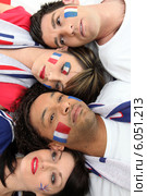 Four French sports fans laying together. Стоковое фото, фотограф Phovoir Images / Фотобанк Лори