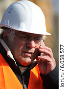 Forman making telephone call. Стоковое фото, фотограф Phovoir Images / Фотобанк Лори
