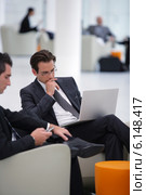Businessmen waiting in airport lounge. Стоковое фото, фотограф Phovoir Images / Фотобанк Лори