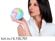 Woman holding globe. Стоковое фото, фотограф Phovoir Images / Фотобанк Лори