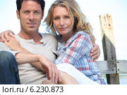 Relaxed mature couple sitting in the sunshine. Стоковое фото, фотограф Phovoir Images / Фотобанк Лори