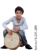 Boy playing a djembe. Стоковое фото, фотограф Phovoir Images / Фотобанк Лори