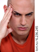 Close-up shot of an angry man. Стоковое фото, фотограф Phovoir Images / Фотобанк Лори