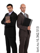 Businessmen standing back to back. Стоковое фото, фотограф Phovoir Images / Фотобанк Лори