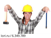 Revolted woman looking at her tools. Стоковое фото, фотограф Phovoir Images / Фотобанк Лори