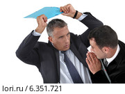 Businessman hitting a colleague. Стоковое фото, фотограф Phovoir Images / Фотобанк Лори