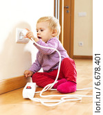Baby playing with electrical extension. Стоковое фото, фотограф Яков Филимонов / Фотобанк Лори
