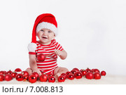 Baby with Christmas decoration on a white background. Стоковое фото, фотограф Александр Савченко / Фотобанк Лори