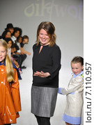 NEW YORK, NY - OCTOBER 18: Designer Amy Wismar walks the runway with models during the Oil & Water preview at petitePARADE / Kids Fashion Week at Bathhouse Studios on October 18, 2014 in New York City. Редакционное фото, фотограф Anton Oparin / Фотобанк Лори