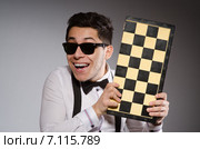 Funny chess player with board. Стоковое фото, фотограф Elnur / Фотобанк Лори