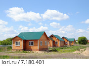 Брусовые домики выстроились в ряд. Заводоуковск (2013 год). Стоковое фото, фотограф Александр Тараканов / Фотобанк Лори