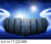 Новые автомобильные колеса на абстрактном синем фоне. Стоковая иллюстрация, иллюстратор Кирилл Черезов / Фотобанк Лори
