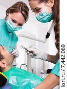 Terrified client in dental clinic. Стоковое фото, фотограф Яков Филимонов / Фотобанк Лори