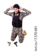Surrendering man in military uniform holding gun isolated on white. Стоковое фото, фотограф Elnur / Фотобанк Лори