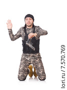 Young man in military uniform holding gun isolated on white. Стоковое фото, фотограф Elnur / Фотобанк Лори