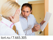 Collector getting the arrears from woman. Стоковое фото, фотограф Яков Филимонов / Фотобанк Лори