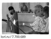 Мальчик на руках в церкви перед крещением. Редакционное фото, фотограф Борис Кавашкин / Фотобанк Лори