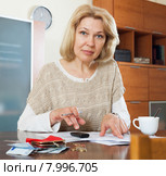 Wistful mature woman thinking. Стоковое фото, фотограф Яков Филимонов / Фотобанк Лори
