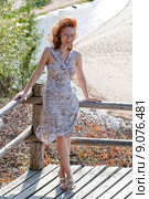 Red-haired adult woman in dune at the se. Стоковое фото, фотограф Roberts Ratuts / PantherMedia / Фотобанк Лори