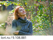 Portrait of red-haired adult woman in na. Стоковое фото, фотограф Roberts Ratuts / PantherMedia / Фотобанк Лори