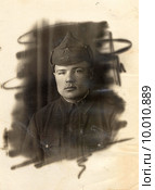 Портрет красноармейца в буденовке. 1941 год. Редакционное фото, фотограф Алексей Гусев / Фотобанк Лори