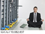 business man practice yoga at network server room. Стоковое фото, фотограф Benis Arapovic / PantherMedia / Фотобанк Лори