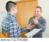 Two men at doorway with keys and contract. Стоковое фото, фотограф Яков Филимонов / Фотобанк Лори