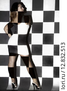 Beautiful woman covered with black and white squares. Стоковое фото, фотограф Art Konovalov / Фотобанк Лори