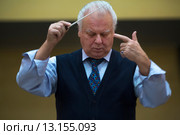 Главный дирижёр Юрий Иванович Симонов дирижирует Академическим симфоническим оркестром Московской филармонии во время репетиции оркестра в городе Москве, Россия (2015 год). Редакционное фото, фотограф Николай Винокуров / Фотобанк Лори