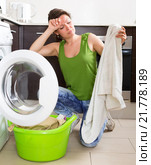 Tired woman doing laundry at home. Стоковое фото, фотограф Яков Филимонов / Фотобанк Лори