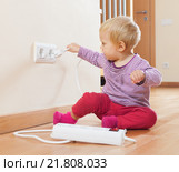 Toddler playing with electrical extension. Стоковое фото, фотограф Яков Филимонов / Фотобанк Лори