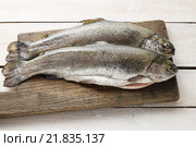 Two rainbow trouts on rustic wooden table. Healthy food. Стоковое фото, агентство BE&W Photo / Фотобанк Лори