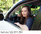 Beautiful young happy woman in car. Стоковое фото, фотограф Валуа Виталий / Фотобанк Лори