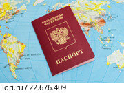 Российский загран паспорт лежит на карте мира. Стоковое фото, фотограф Игорь Низов / Фотобанк Лори
