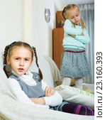 Offended girls sitting apart at home. Стоковое фото, фотограф Яков Филимонов / Фотобанк Лори