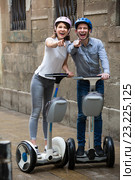 Young couple driving segways. Стоковое фото, фотограф Яков Филимонов / Фотобанк Лори