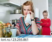 Upset girl and mother have a peeve on each other. Стоковое фото, фотограф Яков Филимонов / Фотобанк Лори